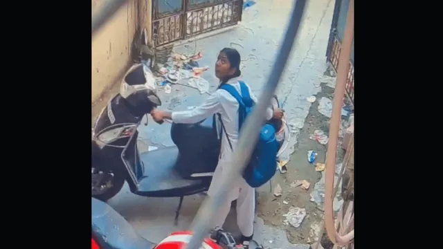 up-viral-video-schoolgirl-runs-away-with-scooty-after-owner-hands-over-keys-to-move-vehicle-aside